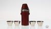 STAINLESS STEEL HUNTING FLASK WITH NIP CUPS WRAPPED IN BURGUNDY LEATHER STAINLESS STEEL HUNTING FLASK WITH NIP CUPS WRAPPED IN BURGUNDY LEATHER