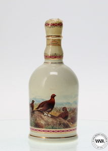 FAMOUS GROUSE 100 YEARS COMMEMORATIVE GOLD LEAF HIGHLAND DECANTER FAMOUS GROUSE 100 YEARS COMMEMORATIVE GOLD LEAF HIGHLAND DECANTER